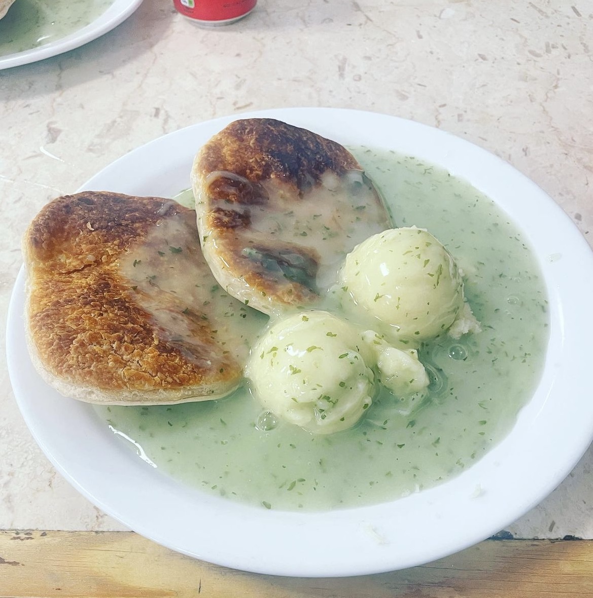 A plate with pie, mashed potatoes and liquor